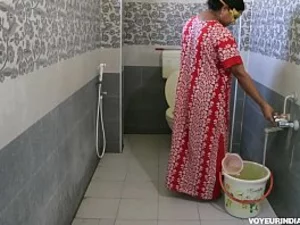 Indian cougar exposes herself, struggles to pee, and gets ignored.
